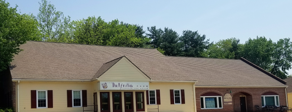 A small building with a sign reading 'Butterfield' and surrounded by trees.